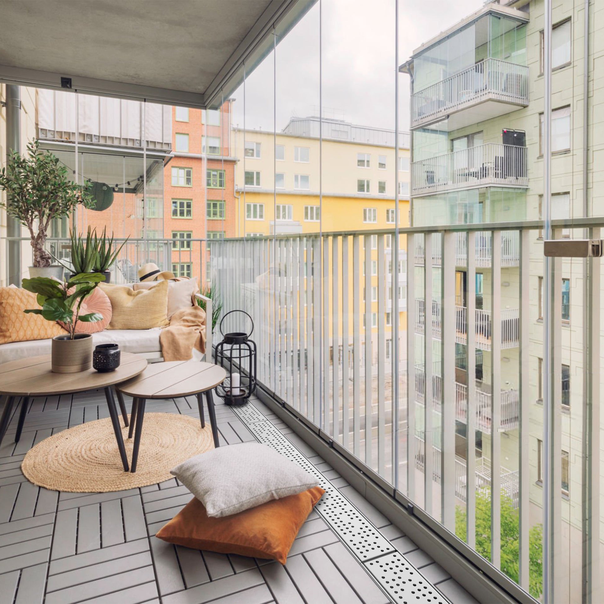 Shallow stainless balcony & patio drain in use on a balcony