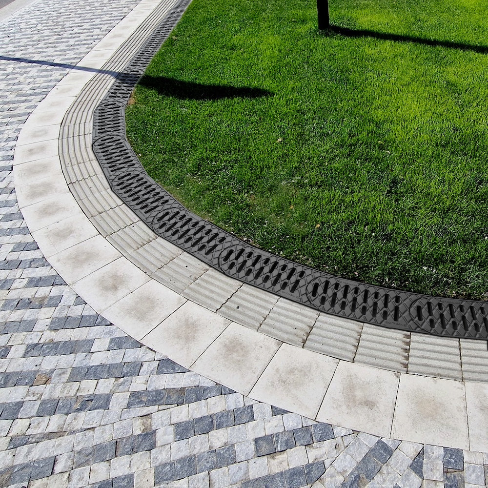 easy channel drain used in between grass and concrete