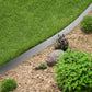 Galvanised Steel Border Edging System dividing grass and woodland