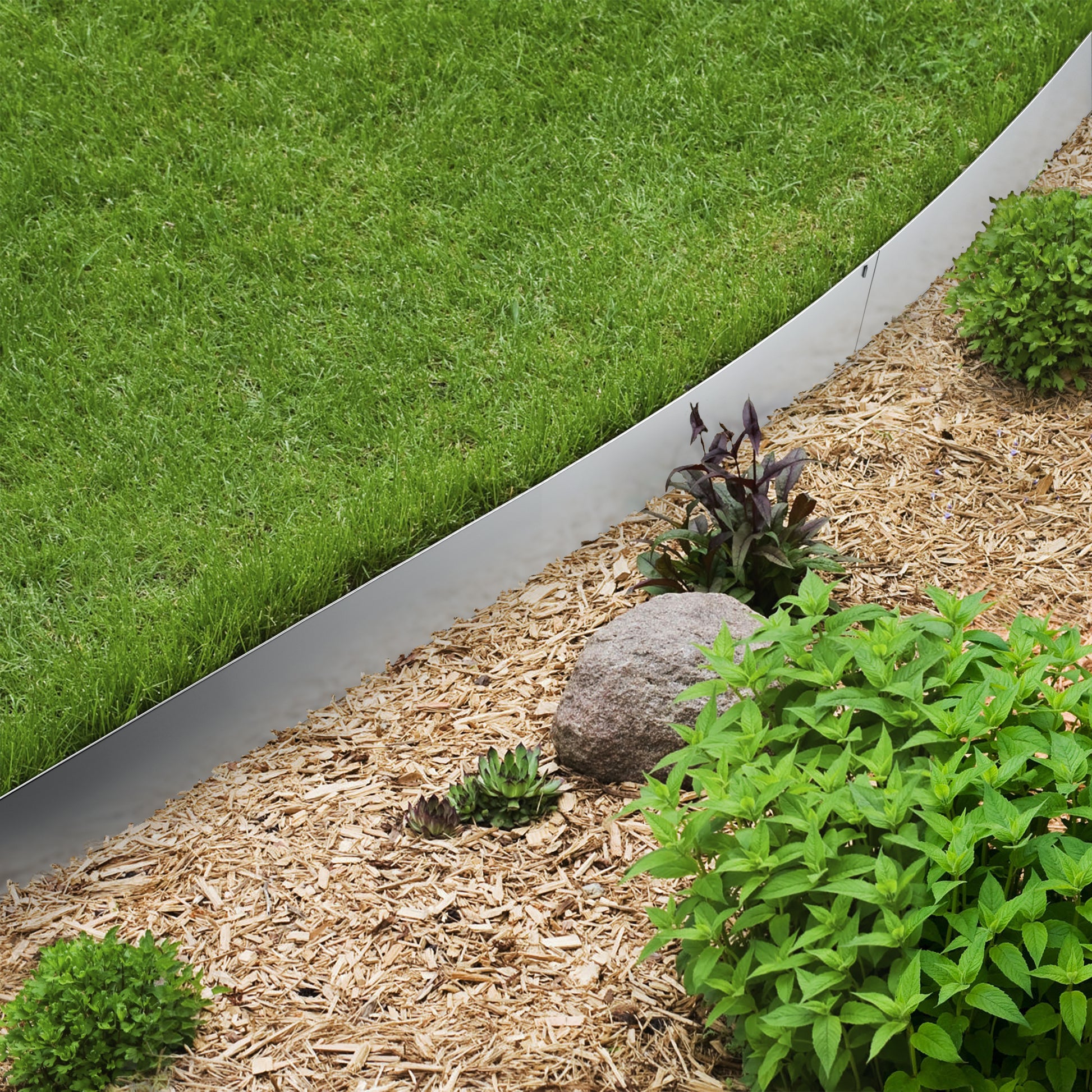 Galvanised Steel Border Edging System dividing grass and woodland